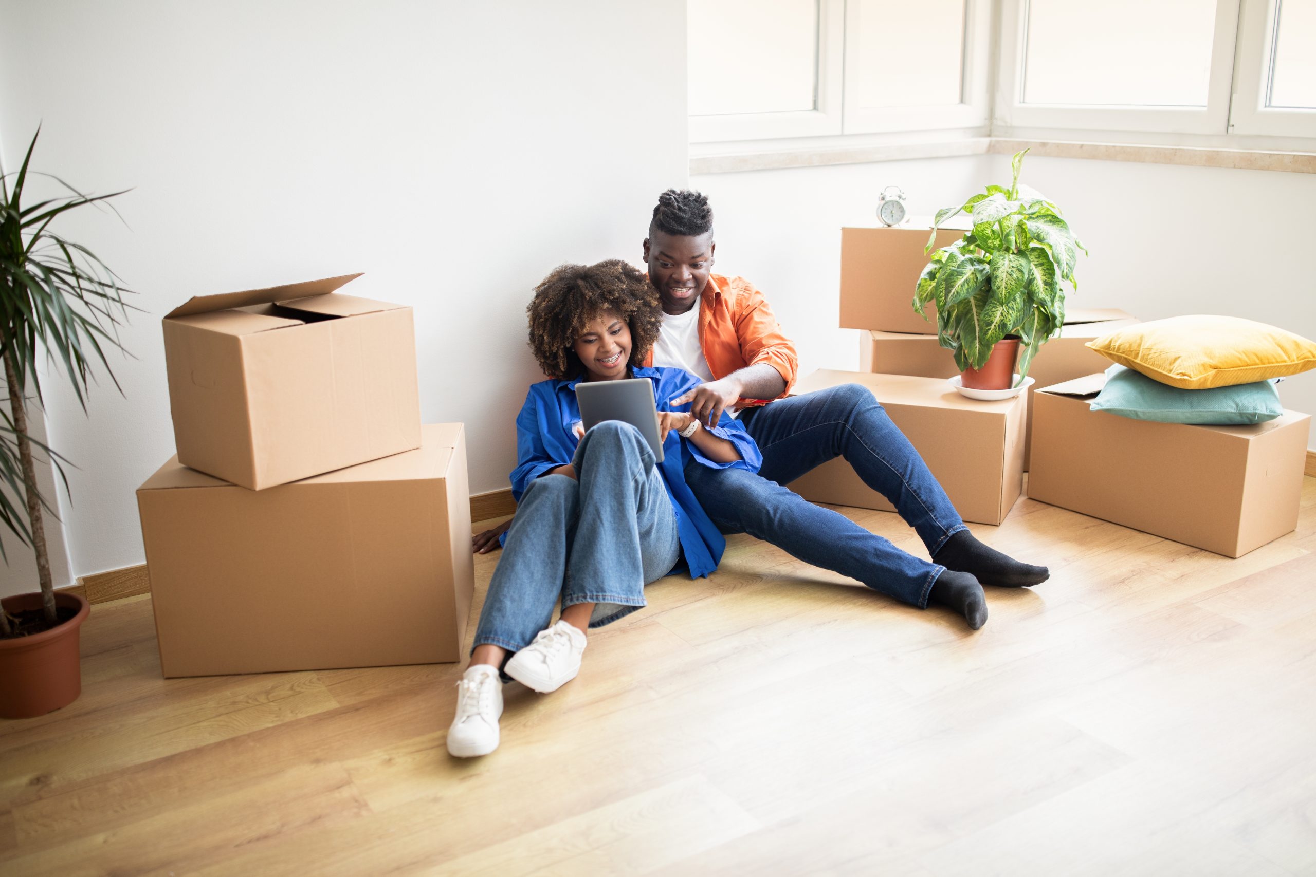 Happy,Young,Black,Couple,Ordering,Online,With,Digital,Tablet,After Happy-man-and-woman-moving-in.jpg
